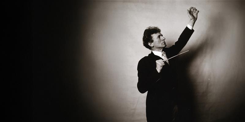 historic photo of Percy Grainger conducting